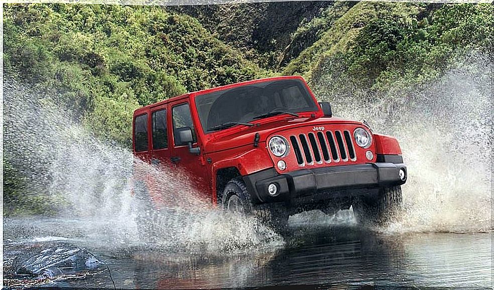 Red Jeep Wrangler off-road