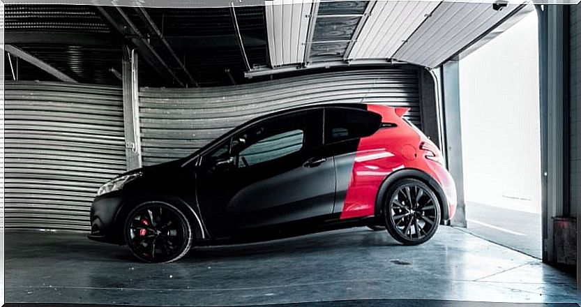 Peugeot 208 GTI by Peugeot Sport design in two-tone red and black.