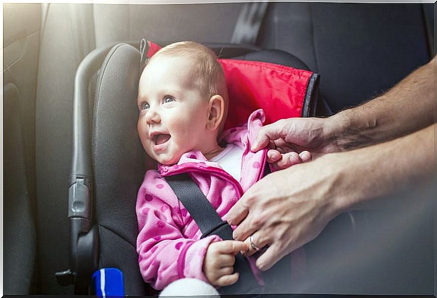 Newborn in a car.